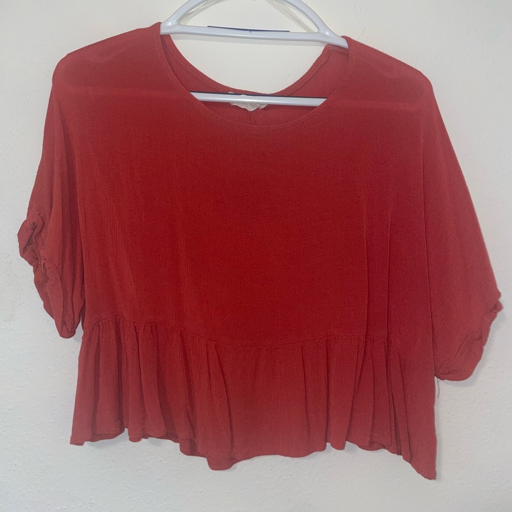 small- red/orange top from altar'd state.
